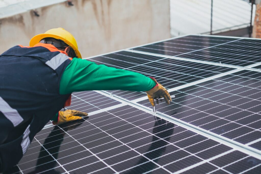 pexels-photo-8853502 Solar Technician Installing Solar Panel